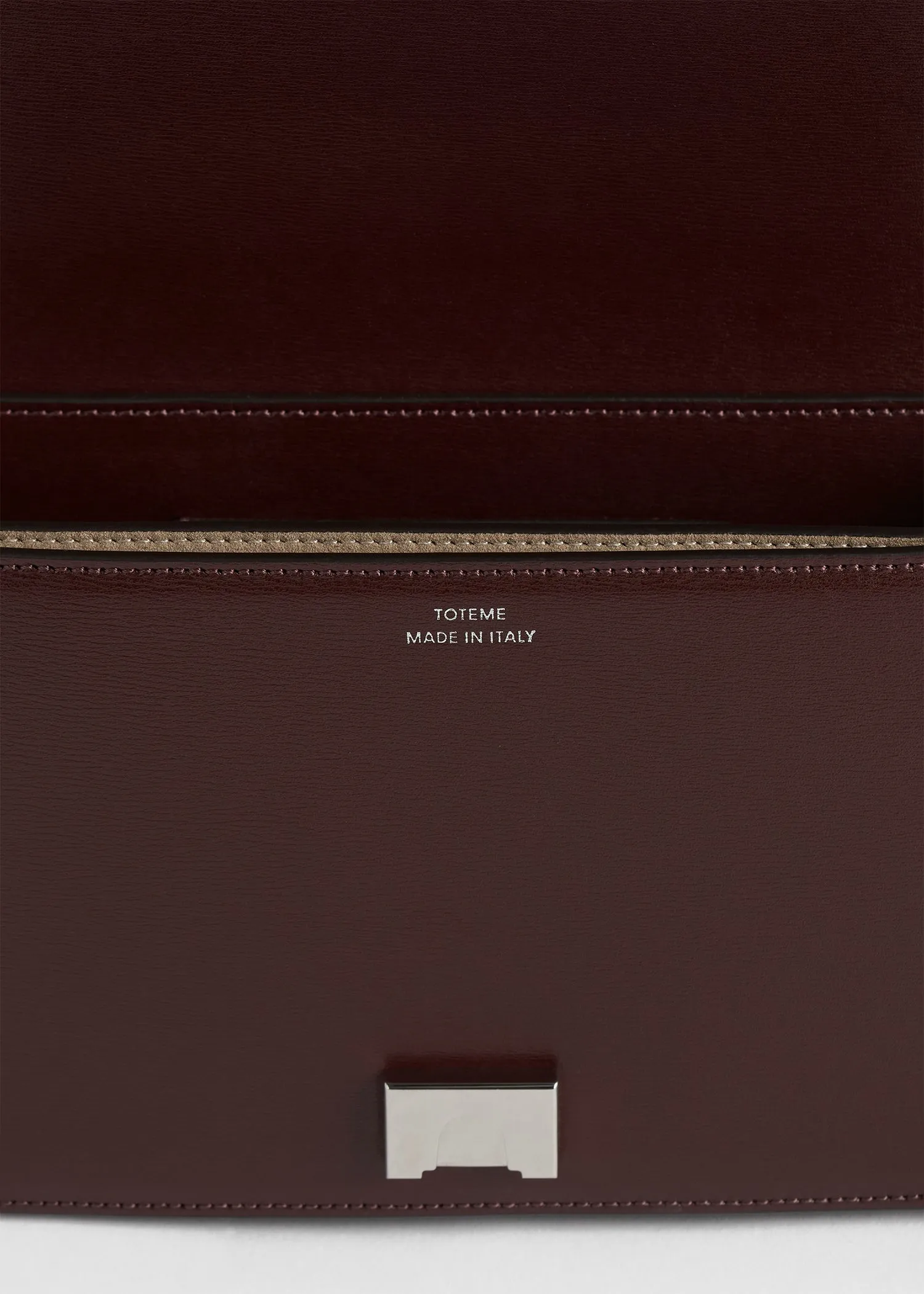 Mini T-flap leather bag bordeaux