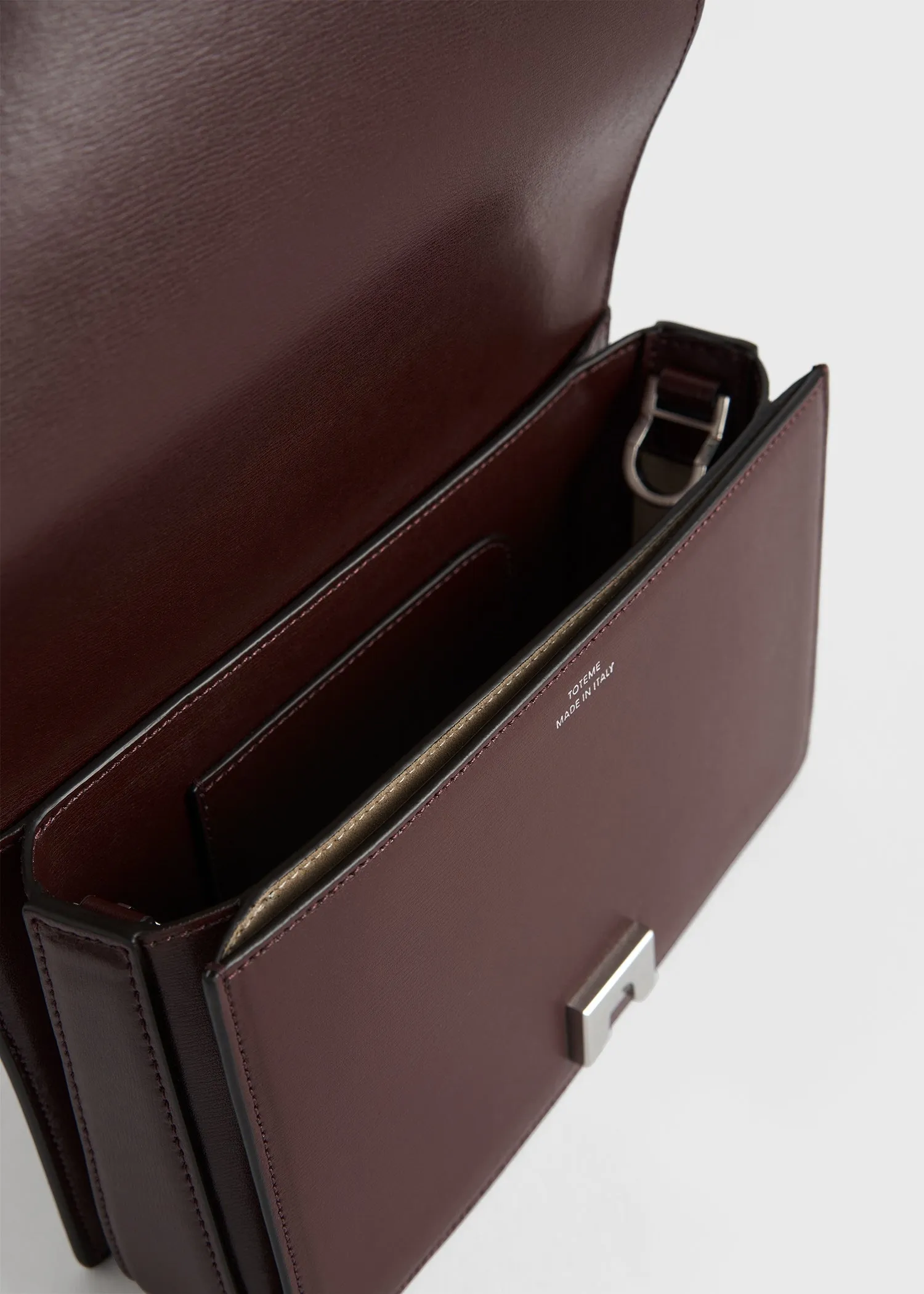 Mini T-flap leather bag bordeaux